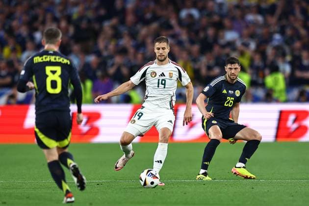 Barnabas Varga of Hungary and Scott McKenna of Scotland Scotland v Hungary, UEFA European Championship, EM, Europameisterschaft 2024, Group A, Football, Stuttgart Arena, Stuttgart, Germany, 23 Jun 2024 EDITORIAL USE ONLY No use with unauthorised audio, video, data, fixture lists, club league logos or live services. Online in-match use limited to 120 images, no video emulation. No use in betting, games or single club league player publications. Copyright: xMichaelxZemanek Shutterstockx 14548075x