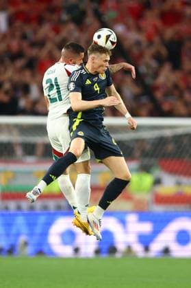 Scott McTominay of Scotland and Endre Botka of Hungary Scotland v Hungary, UEFA European Championship, EM, Europameisterschaft 2024, Group A, Football, Stuttgart Arena, Stuttgart, Germany, 23 Jun 2024 EDITORIAL USE ONLY No use with unauthorised audio, video, data, fixture lists, club league logos or live services. Online in-match use limited to 120 images, no video emulation. No use in betting, games or single club league player publications. Copyright: xKieranxMcManus Shutterstockx 14548072al