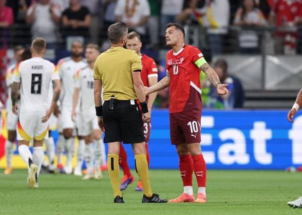 Frankfurt, Germany, 23rd June 2024. Granit Xhaka of Switzerland talks to the referee during the UEFA European Championships match at Commerzbank-Arena, Frankfurt. Picture credit should read: David Klein Sportimage EDITORIAL USE ONLY. No use with unauthorised audio, video, data, fixture lists, club league logos or live services. Online in-match use limited to 120 images, no video emulation. No use in betting, games or single club league player publications. SPI-3203-0048