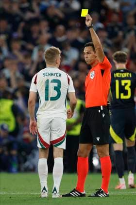 Scotland v Hungary: Group A - UEFA EURO, EM, Europameisterschaft,Fussball 2024 Andras Schafer of Hungary is shown a Yellow card by Referee Facundo Tello during the UEFA EURO 2024 group stage match between Scotland and Hungary at Stuttgart Arena on June 23, 2024 in Stuttgart, Germany. Stuttgart Stuttgart Arena Germany Germany Copyright: xRichardxSellers Sportsphoto APLx 14042347