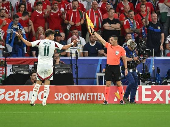 Assistant referee Gabriel Chade reacts with Milos Kerkez during the UEFA EURO 2024 football match between Scotland and Hungary at the Stuttgart Arena in Stuttgart, Sunday 23 June 2024 Cologne Copyright: xRazvanxPasarica SPORTxPICTURESx