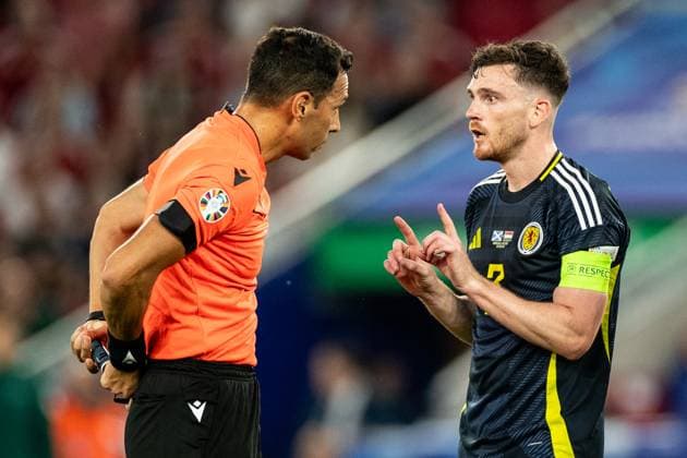 UEFA EURO, EM, Europameisterschaft,Fussball 2024: Schottland - Ungarn; 23.06.2024 Andrew Robertson (Schottland, 3), Facundo Tello (Argentinien, Schiedsrichter) UEFA EURO 2024: Schottland - Ungarn; Stuttgart Stadion, Stuttgart; 23.06.2024 Copyright: xBEAUTIFULxSPORTS Buriakovx
