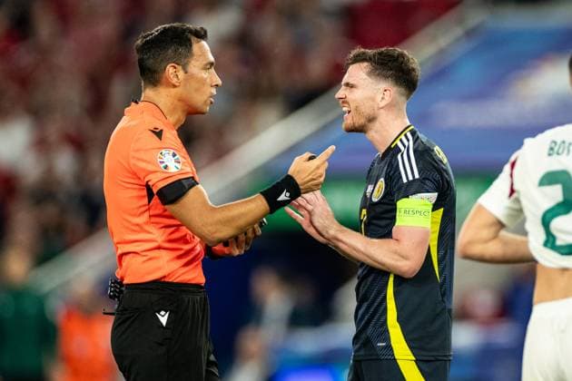 UEFA EURO, EM, Europameisterschaft,Fussball 2024: Schottland - Ungarn; 23.06.2024 Andrew Robertson (Schottland, 3), Facundo Tello (Argentinien, Schiedsrichter) UEFA EURO 2024: Schottland - Ungarn; Stuttgart Stadion, Stuttgart; 23.06.2024 Copyright: xBEAUTIFULxSPORTS Buriakovx