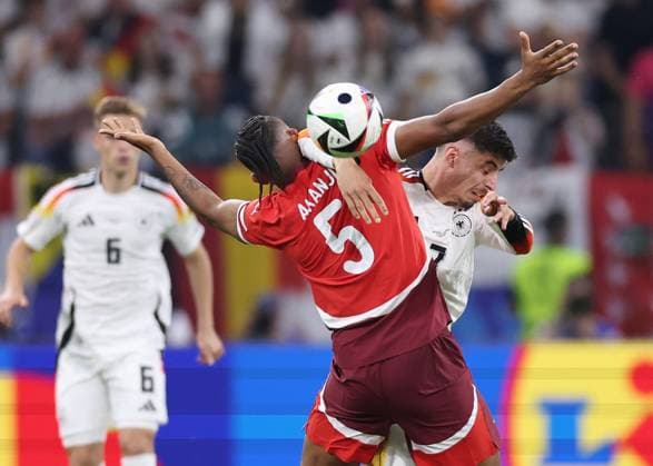 Frankfurt, Germany, 23rd June 2024. Manuel Akanji of Switzerland tussles with Kai Havertz of Germany during the UEFA European Championships match at Commerzbank-Arena, Frankfurt. Picture credit should read: David Klein Sportimage EDITORIAL USE ONLY. No use with unauthorised audio, video, data, fixture lists, club league logos or live services. Online in-match use limited to 120 images, no video emulation. No use in betting, games or single club league player publications. SPI-3203-0084
