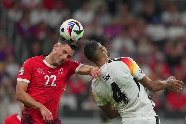 Germany s Jonathan Tah fight for the ball with Switzerland s Fabian Schar during the Euro 2024 soccer match between Switzerland and Germany at the Frankfurt Arena , Frankfurt , Germany - Sunday 23 June 2024. - Soccer .  Copyright: xSpada LaPressex