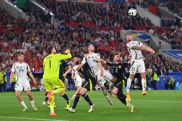 Zusammenprall Barnabas VARGA (19,HUN) mit Torwart Angus GUNN (Schottland), Strafraumszene. Ohnmacht,K.O.Aktion,Zweikampf. re:Endre BOTKA (HUN), Anthony RALSTON (Schottland), Gruppenphase Gruppe A Schottland (SCO) - Ungarn (HUN) 0-1, am 23.06.2024, Stuttgart Arena. Fussball UEFA EURO, EM, Europameisterschaft,Fussball 2024 GERMANY vom 14.06.2024 - 14.07.2024.