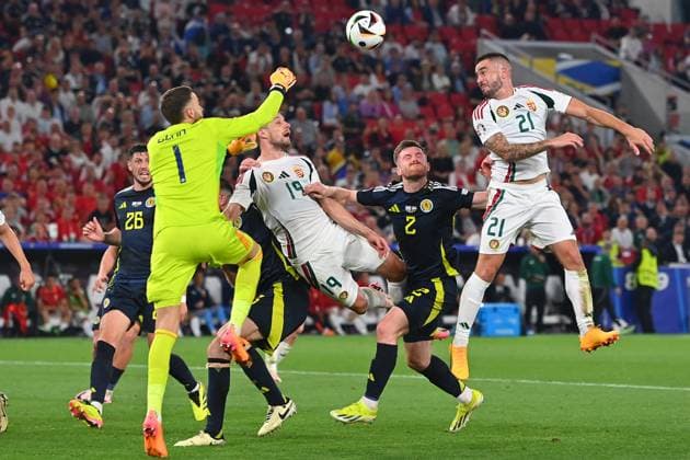 Zusammenprall Barnabas VARGA (19,HUN) mit Torwart Angus GUNN (Schottland), Strafraumszene. Ohnmacht,K.O.Aktion,Zweikampf. re:Endre BOTKA (HUN), Anthony RALSTON (Schottland), Gruppenphase Gruppe A Schottland (SCO) - Ungarn (HUN) 0-1, am 23.06.2024, Stuttgart Arena. Fussball UEFA EURO, EM, Europameisterschaft,Fussball 2024 GERMANY vom 14.06.2024 - 14.07.2024.