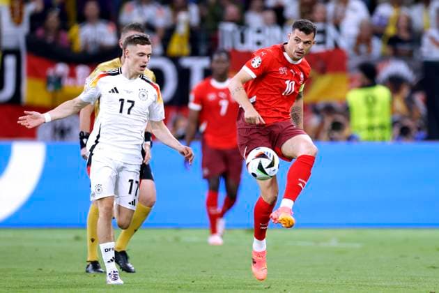 XHAKA Granit Kapitaen Team Schweiz mit WIRTZ Florian UEFA Fussball EURO 2024 in Deutschland Vorrundenspiel Gruppe A Schweiz - Deutschland 1 : 1 am 23.06.2024 in Frankfurt DFL REGULATIONS PROHIBIT ANY USE OF PHOTOGRAPHS as IMAGE SEQUENCES and or QUASI-VIDEO Copyright: xLacixPerenyix