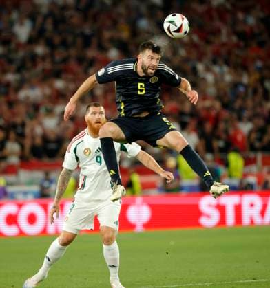 (240624) -- STUTTGART, June 24, 2024 -- Grant Hanley (Top) of Scotland heads the ball during the UEFA EURO, EM, Europameisterschaft,Fussball 2024 Group A match between Scotland and Hungary in Stuttgart, Germany, June 23, 2024. (Photo by Xinhua) (SP)GERMANY-STUTTGART-FOOTBALL-EURO 2024-SCOTLAND VS HUNGARY PhilippexRuiz 