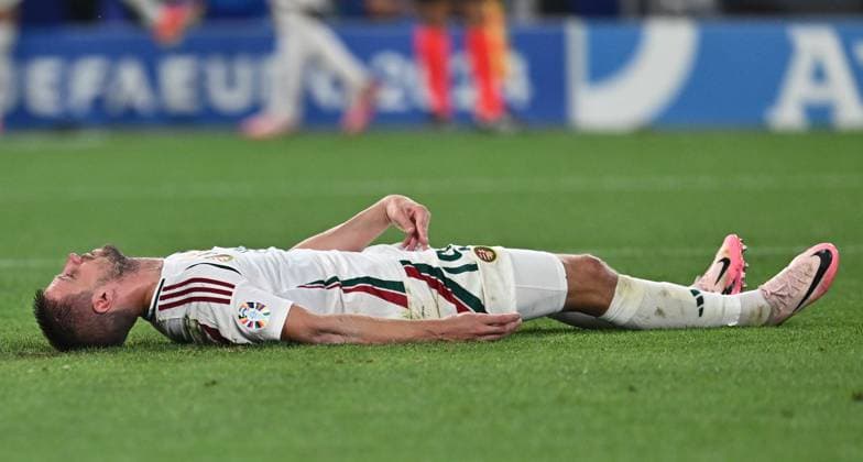 STUTTGART, GERMANY - JUNE 23: Barnabas Varga of Hungary lies on the ground after a collision with goalkeeper Angus Gunn of Scotland during the UEFA EURO, EM, Europameisterschaft,Fussball 2024 group stage match between Scotland and Hungary at Stuttgart Arena on June 23, 2024 in Stuttgart, G Scotland v Hungary: Group A - UEFA EURO 2024 Copyright: xSebastianxFrej MBxMediax