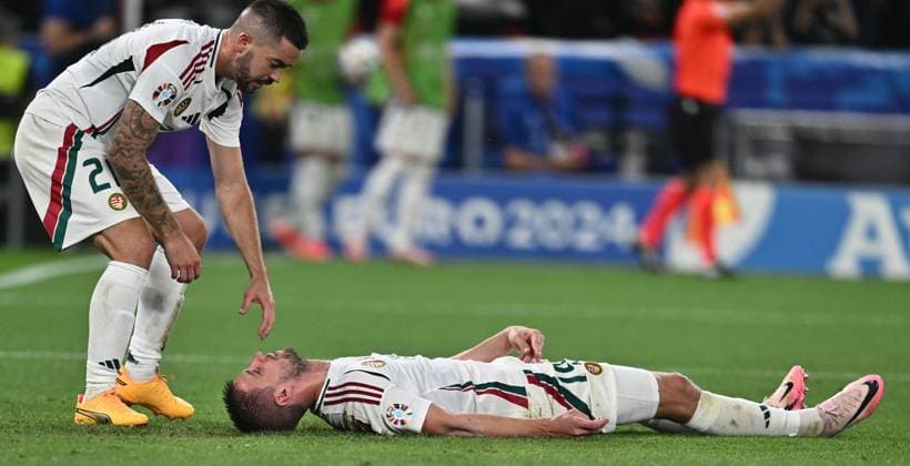 STUTTGART, GERMANY - JUNE 23: Barnabas Varga of Hungary lies on the ground after a collision with goalkeeper Angus Gunn of Scotland during the UEFA EURO, EM, Europameisterschaft,Fussball 2024 group stage match between Scotland and Hungary at Stuttgart Arena on June 23, 2024 in Stuttgart, Germany. Photo by Sebastian Frej Scotland v Hungary: Group A - UEFA EURO 2024 Copyright: xSebastianxFrejx