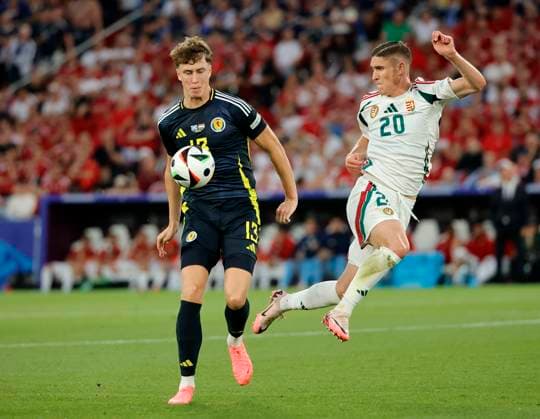 23.06.2024, Fussball Europameisterschaft, Schottland vs Ungarn,MHP Stuttgart, im Bild: Jack Hendry (Schottland) vs Roland Sallai (Ungarn)