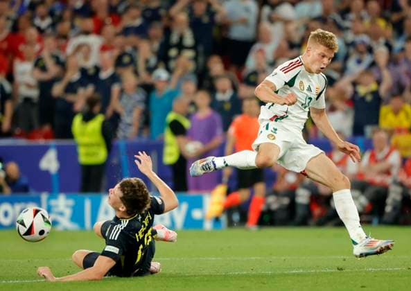 23.06.2024, Fussball Europameisterschaft, Schottland vs Ungarn,MHP Stuttgart, im Bild: Jack Hendry (Schottland) vs Andras Schaefer (Ungarn)