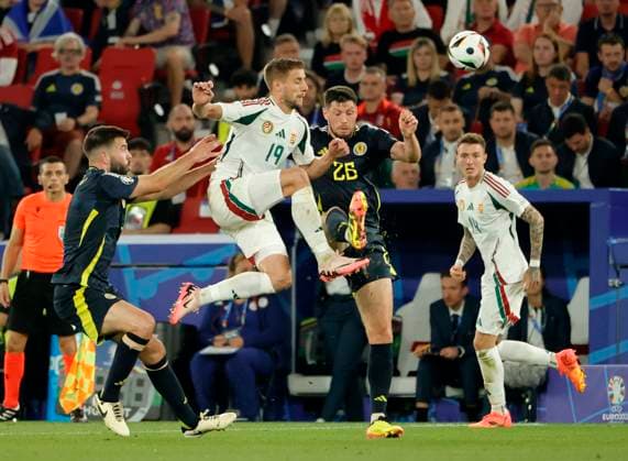 23.06.2024, Fussball Europameisterschaft, Schottland vs Ungarn,MHP Stuttgart, im Bild: Grant Hanley (Schottland), Barnabas Varga (Ungarn), Scott McKenna (Schottland), Bendeguz Bolla (Ungarn)
