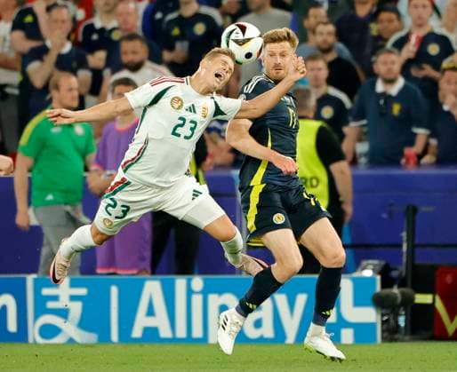 23.06.2024, Fussball Europameisterschaft, Schottland vs Ungarn,MHP Stuttgart, im Bild: Kevin Csoboth (Ungarn) vs Greg Taylor (Schottland)