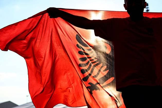 Albania v Spain 24 June 2024, Dusseldorf - UEFA EUROs - Group B - Albania v Spain - An Albania fan carries a flag - Photo: Charlotte Wilson Offside. Dusseldorf Germany Copyright: xCharlottexWilsonx xOffsidexOffside