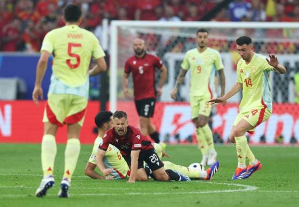 Ylber Ramadani of Albania goes down after a challenge with Mikel Merino of Spain Albania v Spain, UEFA European Championship, EM, Europameisterschaft 2024, Group B, Football, Dusseldorf Arena, Dusseldorf, Germany, 24 Jun 2024 EDITORIAL USE ONLY No use with unauthorised audio, video, data, fixture lists, club league logos or live services. Online in-match use limited to 120 images, no video emulation. No use in betting, games or single club league player publications. Copyright: xPaulxCurrie Shutterstockx 14551058ax