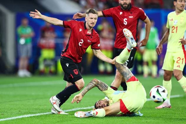 Albania v Spain 24 June 2024, Dusseldorf - UEFA EUROs - Group B - Albania v Spain - Ivan Balliu of Albania runs for the ball as Joselu of Spain falls to the ground - Photo: Charlotte Wilson Offside. Dusseldorf Germany Copyright: xCharlottexWilsonx xOffsidexOffside