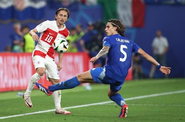 24.06.2024, xtgx, Fussball EM 2024, Kroatien - Italien emspor, v.l. Luka Modric (Kroatien Croatia), Riccardo Calafiori (Italien) (UEFA REGULATIONS PROHIBIT ANY USE OF PHOTOGRAPHS as IMAGE SEQUENCES and or QUASI-VIDEO) Leipzig