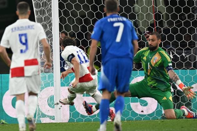 Luka Modric (Croatia)Gianluigi Donnarumma (Italy) he scored the first goal for his team during the UEFA EURO, EM, Europameisterschaft,Fussball Germany 2024 match between Croatia 1-1 Italy at Leipzig Stadium on June 24, 2024 in Leipzig, Germany. Noxthirdxpartyxsales  (257550131)