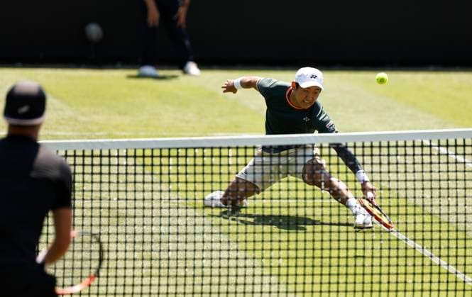25th June 2024; Devonshire Park, Eastbourne, East Sussex, England: Rothesay International Eastbourne, Day 2; Yoshihito Nishioka (JPN) plays a forehand against Liam Broady (GBR) mens singles  ActionPlus12660373 HongboxChen