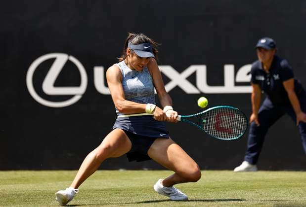 25th June 2024; Devonshire Park, Eastbourne, East Sussex, England: Rothesay International Eastbourne, Day 2, Emma Raducanu (GBR) plays a backhand against Sloane Stephens (USA) womens singles  ActionPlus12660406 HongboxChen