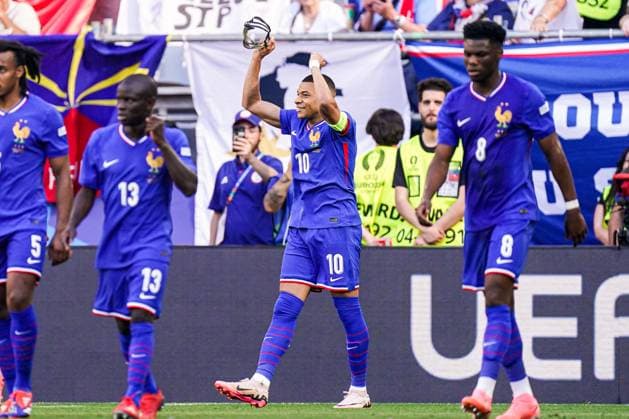 2024-06-25 France v Poland - Group D - UEFA EURO, EM, Europameisterschaft,Fussball 2024 DORTMUND, GERMANY - JUNE 25: Kylian Mbappe of France takes off his mask and celebrates the first goal with his teammates during the Group D - UEFA EURO 2024 match between France and Poland at BVB Stadion Dortmund on June 25, 2024 in Dortmund, Germany. (Photo by Joris Verwijst BSR Agency) Dortmund Germany Content not available for redistribution in The Netherlands directly or indirectly through any third parties. Copyright: xBSRxAgencyx