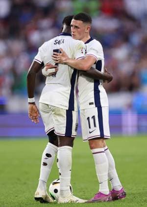 Cologne, Germany, 25th June 2024. Bukayo Saka of England and Phil Foden of England arrange who is going to take a free kick during the UEFA European Championships match at Cologne Stadium, Cologne. Picture credit should read: David Klein Sportimage EDITORIAL USE ONLY. No use with unauthorised audio, video, data, fixture lists, club league logos or live services. Online in-match use limited to 120 images, no video emulation. No use in betting, games or single club league player publications. SPI-3205-0063