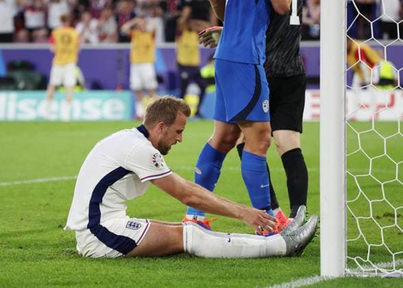 Cologne, Germany, 25th June 2024. Harry Kane of England reacts to a missed chance during the UEFA European Championships match at Cologne Stadium, Cologne. Picture credit should read: David Klein Sportimage EDITORIAL USE ONLY. No use with unauthorised audio, video, data, fixture lists, club league logos or live services. Online in-match use limited to 120 images, no video emulation. No use in betting, games or single club league player publications. SPI-3205-0068