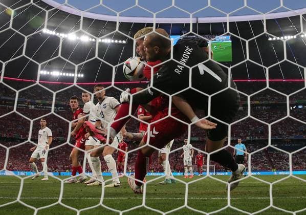 Predrag Rajkovic of Serbia is fouled by Jonas Wind of Denmark and goal is not given Denmark v Serbia, UEFA European Championship, EM, Europameisterschaft 2024, Group C, Football, Munich Football Arena, Munich, Germany, 25 Jun 2024 EDITORIAL USE ONLY No use with unauthorised audio, video, data, fixture lists, club league logos or live services. Online in-match use limited to 120 images, no video emulation. No use in betting, games or single club league player publications.  Copyright: xMichaelxZemanek Shutterstockx 14555536bn