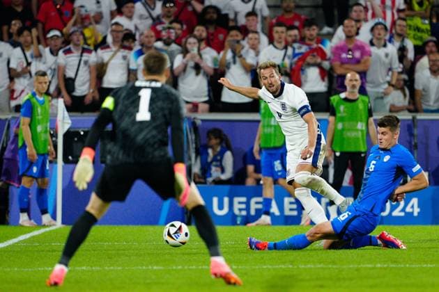 Harry Kane of England plays the ball across goal England v Slovenia, UEFA European Championship, EM, Europameisterschaft 2024, Group C, Football, Cologne Stadium, Cologne, Germany, 25 Jun 2024 EDITORIAL USE ONLY No use with unauthorised audio, video, data, fixture lists, club league logos or live services. Online in-match use limited to 120 images, no video emulation. No use in betting, games or single club league player publications. Copyright: xDavexShopland Shutterstockx 14555527cg