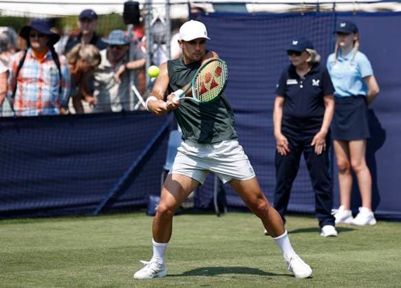 26th June 2024; Devonshire Park, Eastbourne, East Sussex, England: Rothesay International Eastbourne, Day 3; Marcos Giron (USA) plays a backhand against Yoshihito Nishioka (JPN) , mens singles match  ActionPlus12660706 HongboxChen