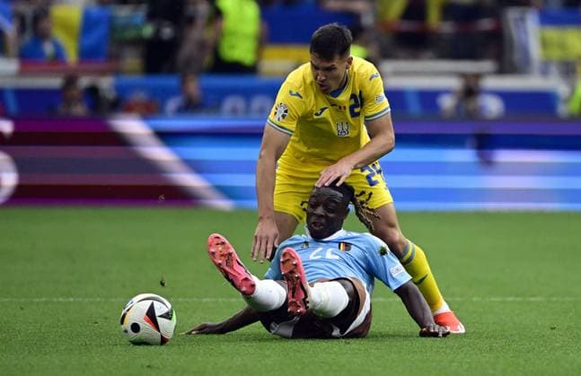 Belgium s Jeremy Doku and Ukraine s Oleksandr Tymchyk fight for the ball during a soccer game between Ukraine and Belgian national soccer team Red Devils, Wednesday 26 June 2024 in Stuttgart, Germany, the third match in the group stage of the UEFA EURO, EM, Europameisterschaft,Fussball 2024 European championships. DIRKxWAEM  x95323520x