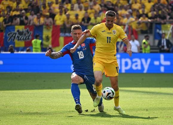 26.06.2024, xsltx, Fussball EM 2024, Slowakei - Rumänien emspor, v.l. Juraj Kucka (Slowakei), Nicusor Silviu Bancu (Rumänien Rumaenien) (DFL DFB REGULATIONS PROHIBIT ANY USE OF PHOTOGRAPHS as IMAGE SEQUENCES and or QUASI-VIDEO) Frankfurt