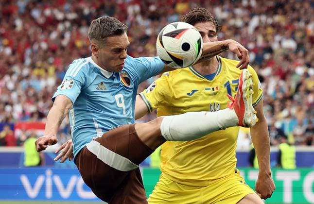 Belgium s Leandro Trossard and Ukraine s Illya Zabarnyi pictured in action during a soccer game between Ukraine and Belgian national soccer team Red Devils, Wednesday 26 June 2024 in Stuttgart, Germany, the third match in the group stage of the UEFA EURO, EM, Europameisterschaft,Fussball 2024 European championships. BRUNOxFAHY  x95324725x