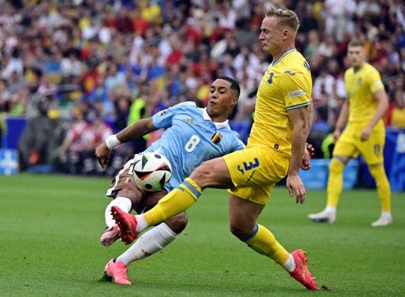 Belgium s Youri Tielemans and Ukraine s Oleksandr Svatok fight for the ball during a soccer game between Ukraine and Belgian national soccer team Red Devils, Wednesday 26 June 2024 in Stuttgart, Germany, the third match in the group stage of the UEFA EURO, EM, Europameisterschaft,Fussball 2024 European championships. DIRKxWAEM  x95328320x