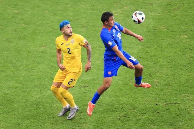 Football - UEFA EURO, EM, Europameisterschaft,Fussball 2024 - Group E - Slovakia v Romania 26th June 2024 - UEFA EURO 2024 - Group E - Slovakia v Romania - David Strelec of Slovakia and Andrei Ratiu of Romania - Photo: Simon Stacpoole Offside. Frankfurt Germany Copyright: xSimonxStacpoolexOffside