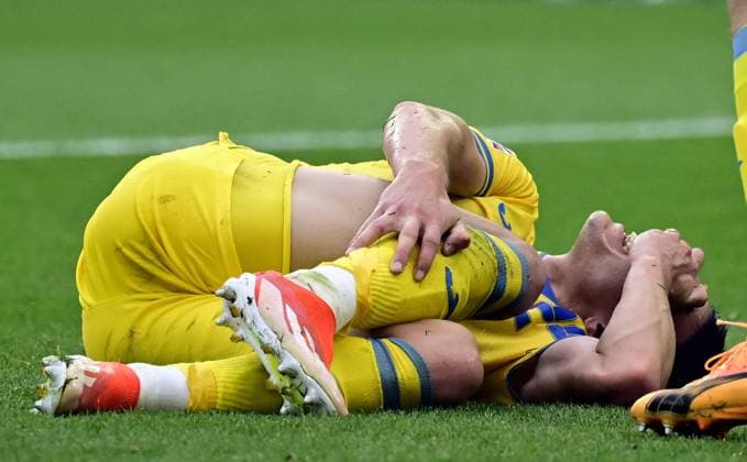 Ukraine s Oleksandr Tymchyk lies injured during a soccer game between Ukraine and Belgian national soccer team Red Devils, Wednesday 26 June 2024 in Stuttgart, Germany, the third match in the group stage of the UEFA EURO, EM, Europameisterschaft,Fussball 2024 European championships. DIRKxWAEM  x95329418x