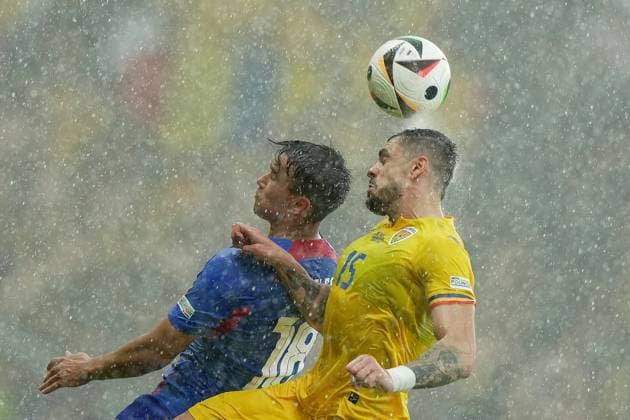 Romania s Andrei Burca fight for the ball with Slovakia s David Strelec during the Euro 2024 soccer match between Slovakia and Romania at the Frankfurt Arena , Frankfurt , Germany - Wednesday 26 June 2024. - Soccer .  Copyright: xSpada LaPressex