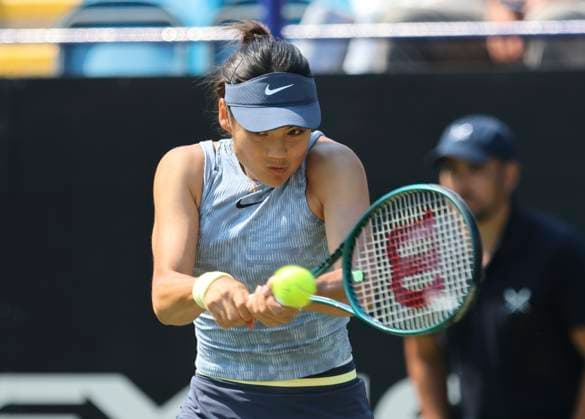 26th June 2024; Devonshire Park, Eastbourne, East Sussex, England: Rothesay International Eastbourne, Day 3, Emma Raducanu (GBR) plays a backhand against Jessica Pegula (USA) in her womens singles match  ActionPlus12660823 HongboxChen