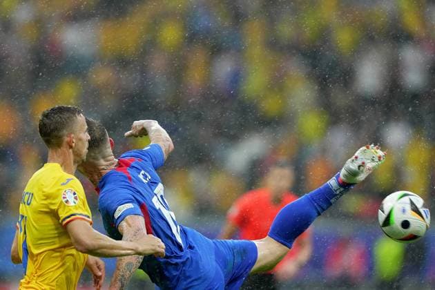 Romania s Nicusor Bancu fight for the ball with during Slovakia s Juraj Kucka the Euro 2024 soccer match between Slovakia and Romania at the Frankfurt Arena , Frankfurt , Germany - Wednesday 26 June 2024. - Soccer .  Copyright: xSpada LaPressex