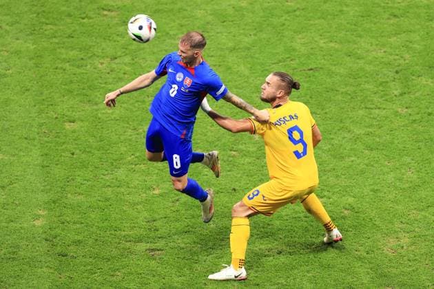Football - UEFA EURO, EM, Europameisterschaft,Fussball 2024 - Group E - Slovakia v Romania 26th June 2024 - UEFA EURO 2024 - Group E - Slovakia v Romania - Ondrej Duda of Slovakia and George Puscas of Romania - Photo: Simon Stacpoole Offside. Frankfurt Germany Copyright: xSimonxStacpoolexOffside