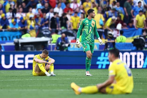 Dejected looking Ukraine players after the full time whistle Ukraine v Belgium, UEFA European Championship, EM, Europameisterschaft 2024, Group E, Football, Stuttgart Arena, Stuttgart, Germany - 26 Jun 2024 EDITORIAL USE ONLY No use with unauthorised audio, video, data, fixture lists, club league logos or live services. Online in-match use limited to 120 images, no video emulation. No use in betting, games or single club league player publications. Copyright: xMichaelxZemanek Shutterstockx 14555605bs