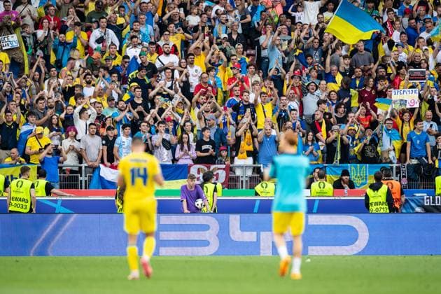 UEFA EURO, EM, Europameisterschaft,Fussball 2024: Ukraine - Belgien; 26.06.2024 Georgiy Sudakov (Ukraine, 14), Yukhym Konoplia (Ukraine, 2) nach dem Spielende, traurig. Fans auf dem Hintergrund, Spieler sind unscharf UEFA EURO 2024: Ukraine - Belgien; Stuttgart Stadion, Stuttgart; 26.06.2024 Copyright: xBEAUTIFULxSPORTS Buriakovx