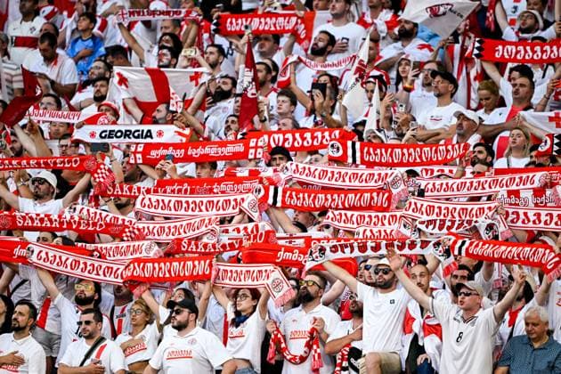 2024-06-26 Georgia v Portugal - Group F - UEFA EURO, EM, Europameisterschaft,Fussball 2024 GELSENKIRCHEN, GERMANY - JUNE 26: Fans of Georgia showing scarves during the Group F - UEFA EURO 2024 match between Georgia and Portugal at Arena AufSchalke on June 26, 2024 in Gelsenkirchen, Germany. (Photo by Pablo Morano BSR Agency) Gelsenkirchen Germany Content not available for redistribution in The Netherlands directly or indirectly through any third parties. Copyright: xBSRxAgencyx