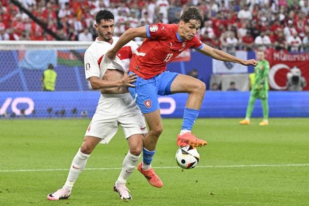 From left Samet Akaydin of Turkey and Czech Mojmir Chytil in action during the Group F match of the European Football Championship: Turkey vs Czechia, in Hamburg, Germany, on June 26, 2024. (CTKxPhoto VitxSimanek) CTKPhotoP2024062609142  CTKPhotoP2024062609142