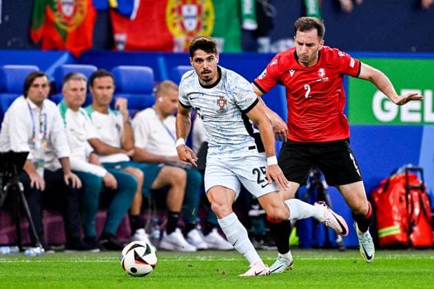 2024-06-26 Georgia v Portugal - Group F - UEFA EURO, EM, Europameisterschaft,Fussball 2024 GELSENKIRCHEN, GERMANY - JUNE 26: Pedro Neto of Portugal battles for possession with Otar Kakabadze of Georgia during the Group F - UEFA EURO 2024 match between Georgia and Portugal at Arena AufSchalke on June 26, 2024 in Gelsenkirchen, Germany. (Photo by Pablo Morano BSR Agency) Gelsenkirchen Germany Content not available for redistribution in The Netherlands directly or indirectly through any third parties. Copyright: xBSRxAgencyx