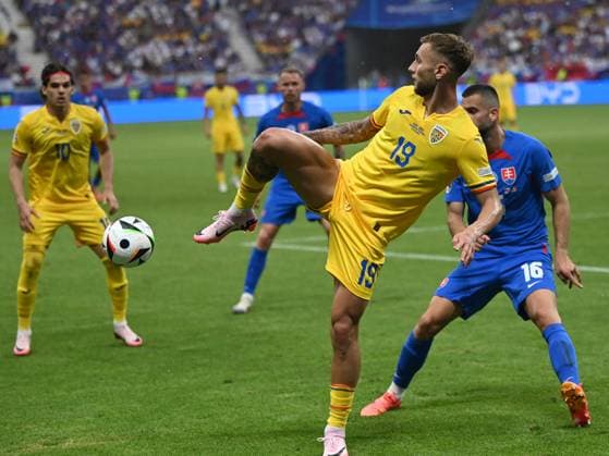 Denis DrÄƒguÅü and David Hancko during the UEFA EURO 2024 football match between Slovakia and Romania at the Frankfurt Arena in Frankfurt, Wednesday, June 26, 2024 Frankfurt Copyright: xRazvanxPasarica SPORTxPICTURESx