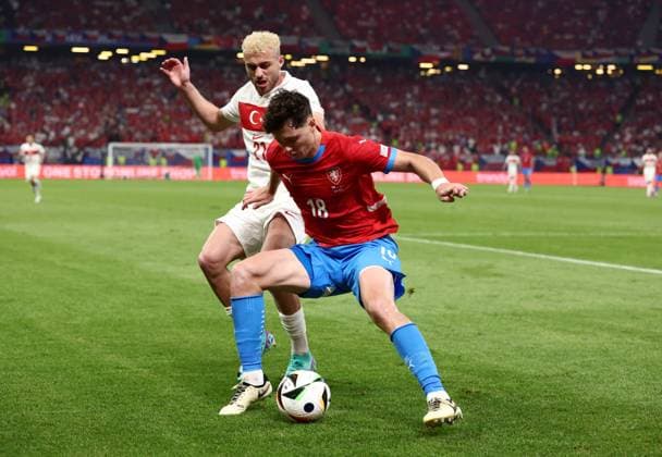 Ladislav Krejci of Czechia is challenged by Baris Alper Yilmaz of Türkiye Czechia v Turkiye, UEFA European Championship, EM, Europameisterschaft 2024, Group F, Football, Volksparkstadion, Hamburg, Germany - 26 Jun 2024 EDITORIAL USE ONLY No use with unauthorised audio, video, data, fixture lists, club league logos or live services. Online in-match use limited to 120 images, no video emulation. No use in betting, games or single club league player publications. Copyright: xMattxWest Shutterstockx 14555612br