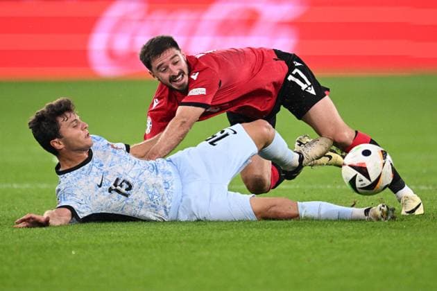 Germany Soccer Euro 2024 Georgia - Portugal 8717002 26.06.2024 Portugal s Joao Neves, left, and Georgia s Otar Kiteishvili fall as they struggle for the ball during the UEFA EURO, EM, Europameisterschaft,Fussball 2024 Group F soccer match between Georgia and Portugal at the Veltins-Arena in Gelsenkirchen, Germany. Alexey Filippov Sputnik Gelsenkirchen Germany  Copyright: xAlexeyxFilippovx